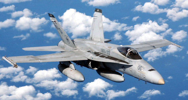 A US Marine Corps F/A-18C of Marine Fighter Attack Squadron 212 (VMFA-212) flies over the South China Sea in 2003. (US Navy)